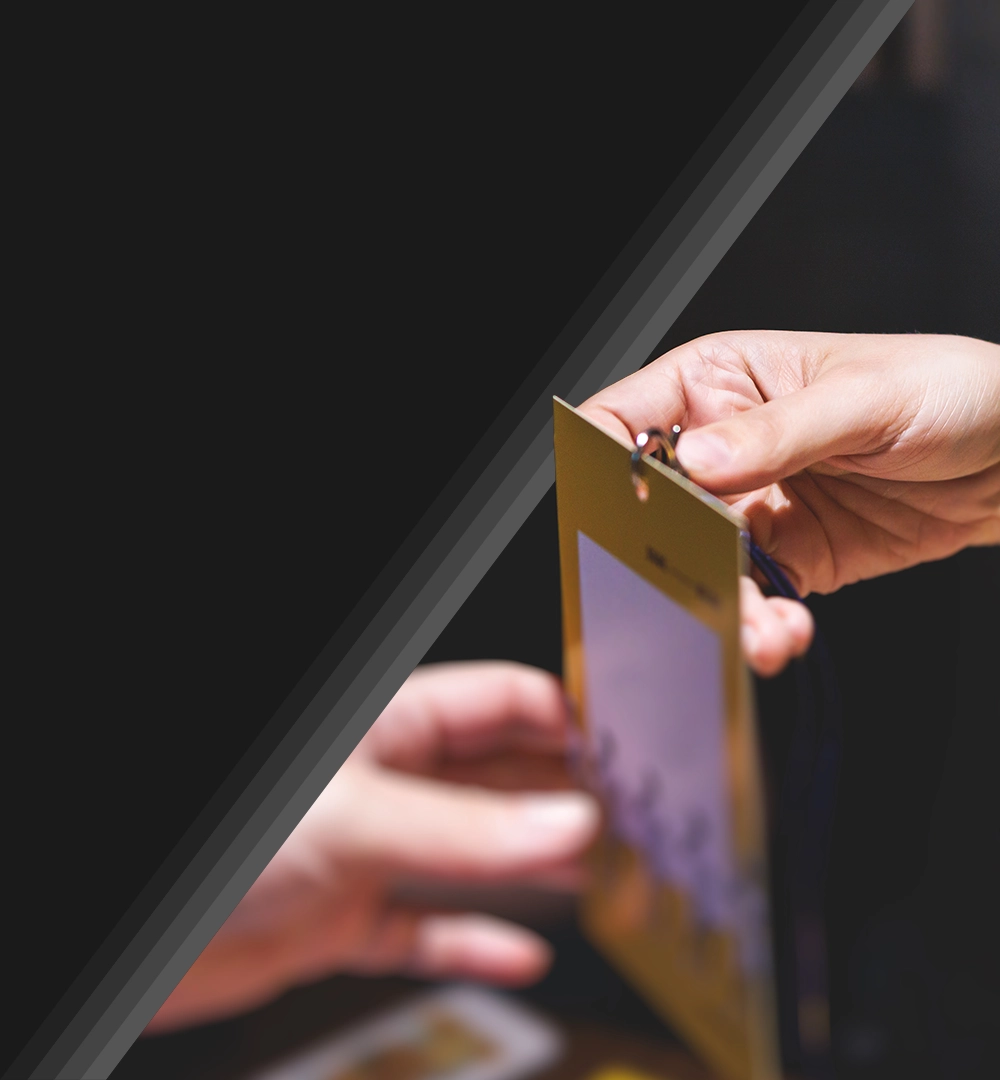 lanyard for event being handed to attendee.