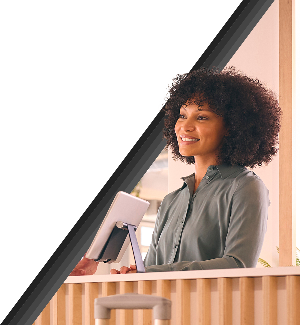 young attendee checking into a conference at a kiosk.